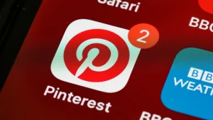 Pinterest app icon with a notification badge on a smartphone screen