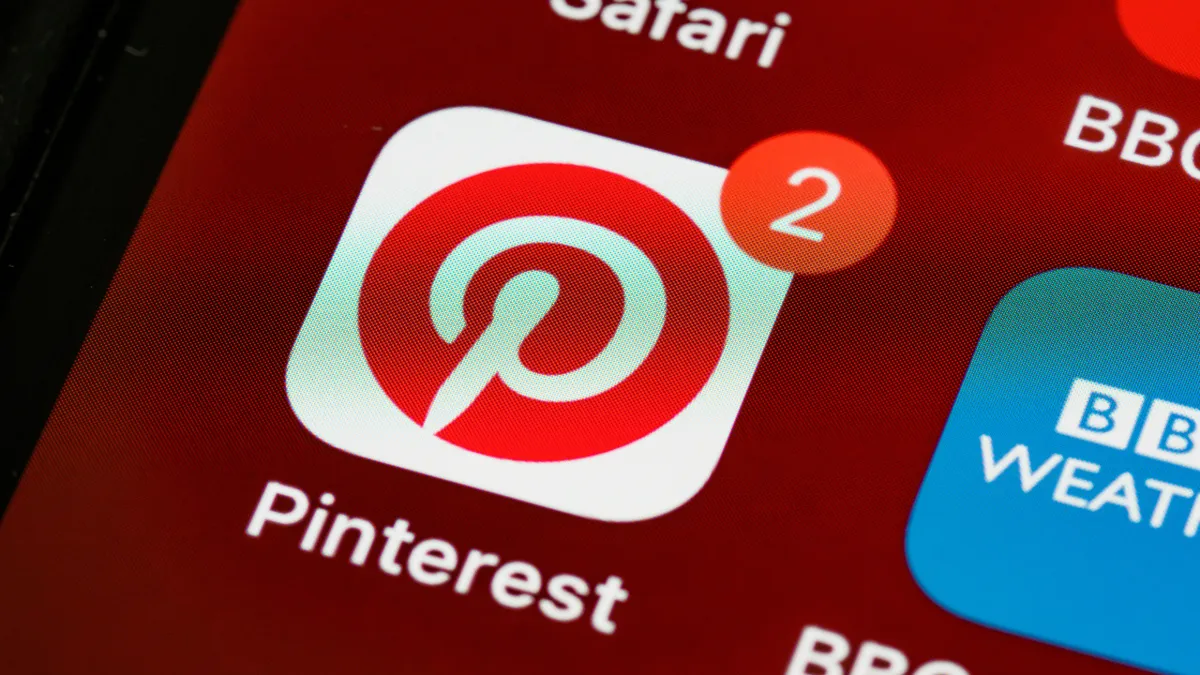 Pinterest app icon with a notification badge on a smartphone screen