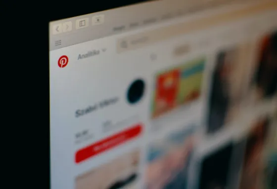 Pinterest feed on a screen in a creative workspace