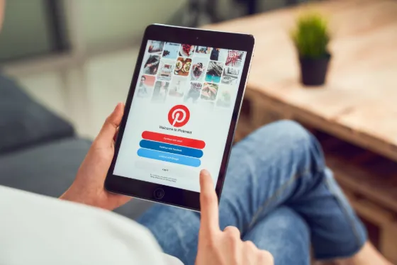 Pinterest open on a laptop in a bright workspace
