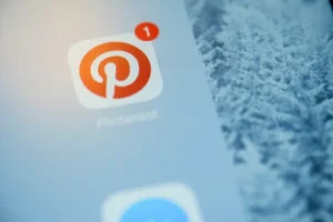 Person holding a tablet with Pinterest open